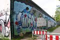 Durch Graffiti zerstörte Wandgestaltung des Mädchentreffs